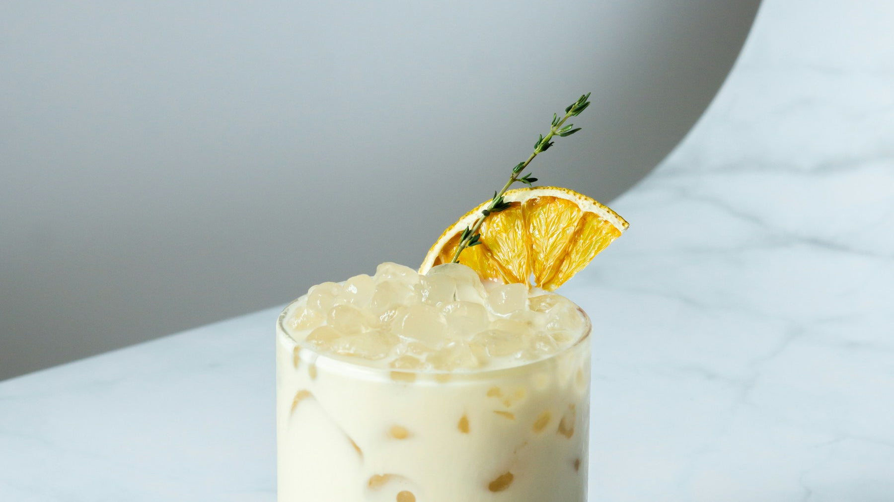 Whisky Sour cocktail with citrus garnish