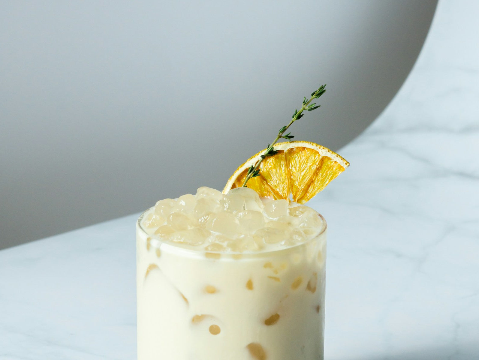 Whisky Sour cocktail with citrus garnish
