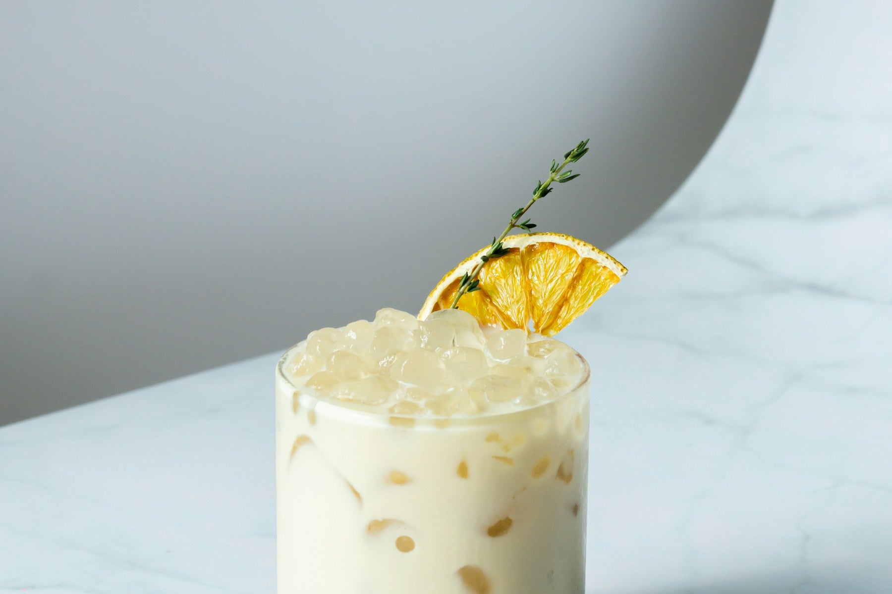 Whisky Sour cocktail with citrus garnish