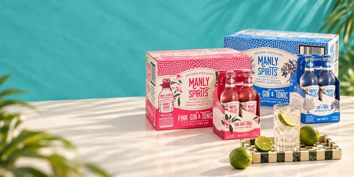 Manly Spirits Australian Dry and Lilly Pilly Pink Gin and Tonic cases and four-packs with a tall gin and tonic glass.