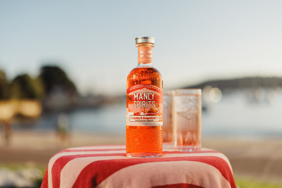 Lychee & Dragonfruit Liqueur with two Paradise Spritzes by the water